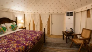 Gallery - Damodra Desert Camp 33 bed and sitting area luxury swiss tent damodra desert camp