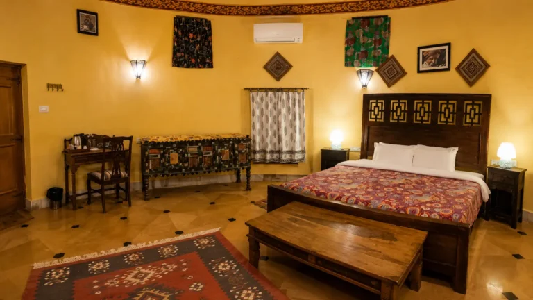 bed and workstation at luxury cottage suite at damodra desert camp