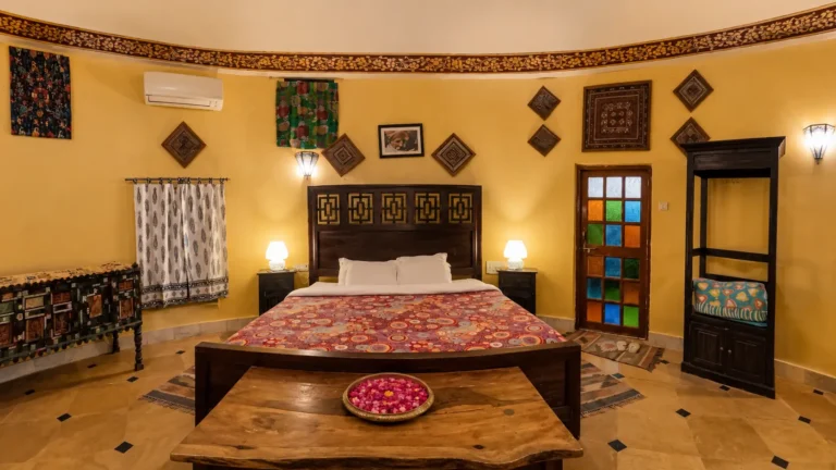 bed in luxury cottage suite at damodra desert camp