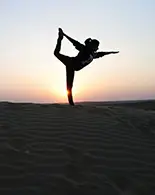 sunrise yoga on dunes